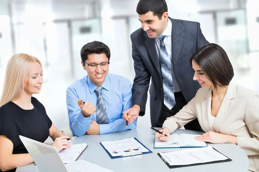 Team looking over charts Team looking over charts